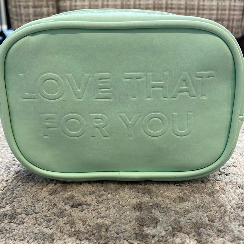 "Love that for you" slogan makeup bag